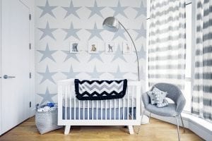 A white crib on a white painted room looks better compared to a bassinet or any other crib.