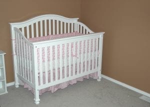 put it at the center of the bed. Never put it near the edges, to keep the newborn away from falling off.