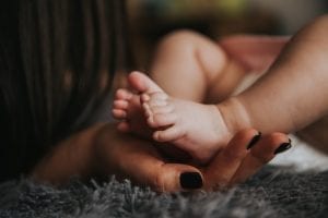 cute, little feet of a newborn baby. They are irresistible that parents cannot stop holding them