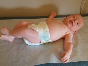 Baby wearing pampers. You can get free pampers from the Pampers rewards catalog. Choose from the different pampers.