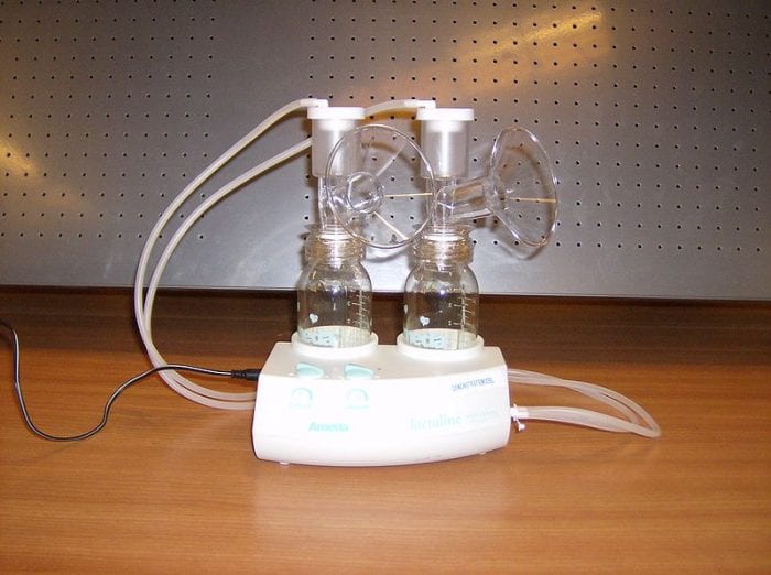 A photo of a double breast pump. Follow our tips to make your breast pump journey safer & more enjoyable.