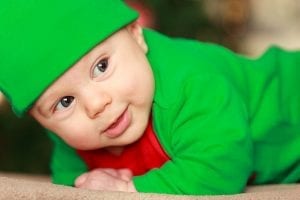 A cute, adorable baby showing his smile could light up parents.