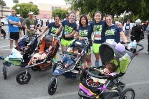 Happy moms with their babies on the stroller. Happy babies and happy mommies just trying to spend a good day!