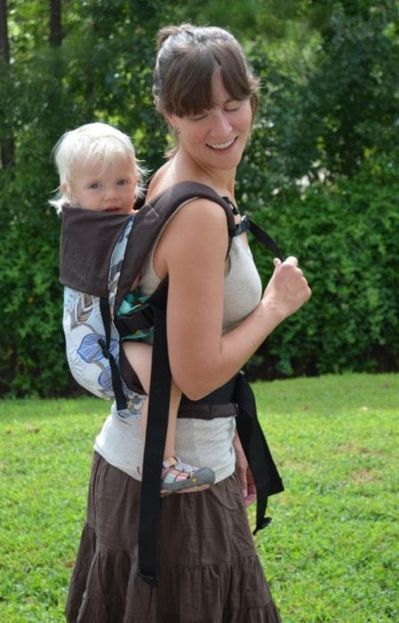 A baby using a baby carrier. A baby carrier is a big help. Choose a baby carrier you want. Choose a baby carrier that is comfortable.