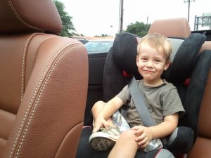 Boy having his best ride with the best convertible child car seat