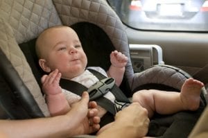 a baby in a car seat