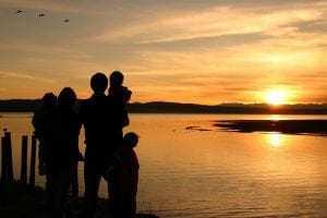 a family enjoying the sunset