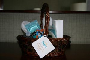 There is a basket. This might be a gift set from pampers based on the tag.