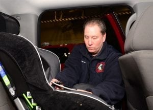 Infant car seat installation. An ideal infant car seat installed correctly