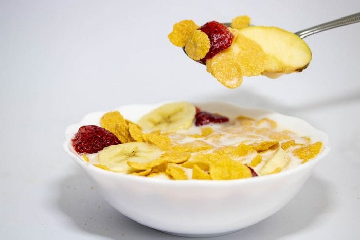 Athletes breakfast: A bowl of cereals, fruits and milk. High in teen vitamins needed for athletes daily activities,