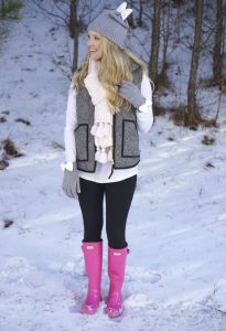 Boot Hunter is one of the top snow boots. It's stylish and most women would love to have a pair of it. Blonde girl in the snow with pink snow boots, she smiled as she look to her left while outside of a snowy yard.. Perfect college boots.