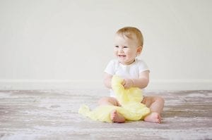 a cute baby with the best captivating smile.