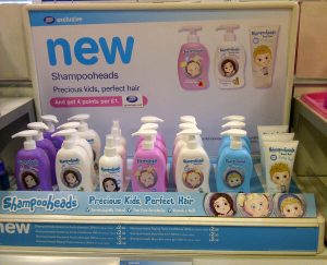 Shampoo for kids: Display of the best shampoo and conditioner for kids, 'Shampooheads' - Precious Kids, Perfect Hair, on a store shelf.