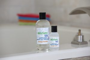 Shampoo for kids: Bottles of the best Nature's Baby Organics shampoo & conditioner for kids on a bathroom counter.