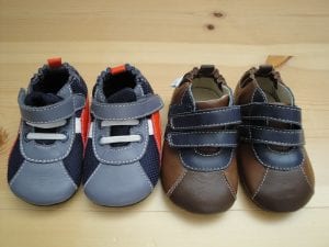 Two pairs of baby shoes with straps for easy and convenient use.