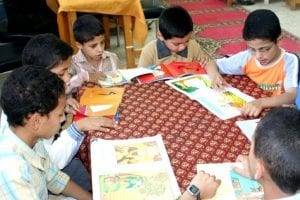 male students are reading for educational development