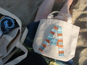 Tote bags made of canvas are perfect for the beach and on-the-go mothers. It's very minimal, yet stylish and practical.
