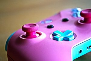 controller in pink and blue used for Xbox