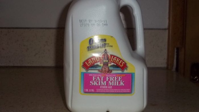 Skim milk contains less calories, carbs, protein and zero fat compared to regular full fat milk. It is like you eat or take less nutrients with skimmed milk. Fat Free Skim Milk in container. Skimmed milk is 0 grams trans fat.