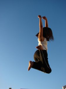 The girl is bouncing on a Skybound 10-inch trampoline