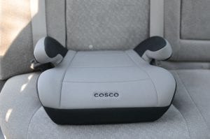 A cosco booster for kids. It has gray and black color. 