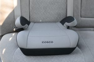 A cosco booster for kids. It has gray and black color.