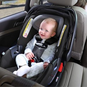 The infant is using the Britax car seat before his long drive. The seat will keep the baby safe when travelling or just going somewhere with his family. 