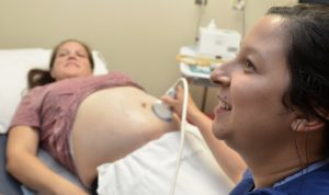 At a pregnancy appointment getting a checkup. It is always best to do an ultrasound every visit to the doctor. It is safe during pregnancy. Ultrasound for pregnancy