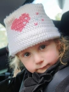 A child sitting comfortably in their Symphony car seat