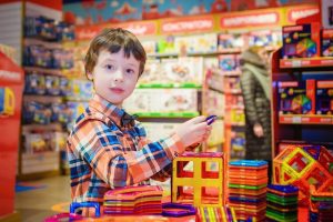 6 year old boy is searching for the best toys. 