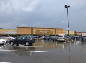 Walmart store with many cars parked in front. Home of different kinds of trampoline products that you can use at home for you and you family. Wait for deals and buy trampoline products now at Walmart during the black friday deals. 