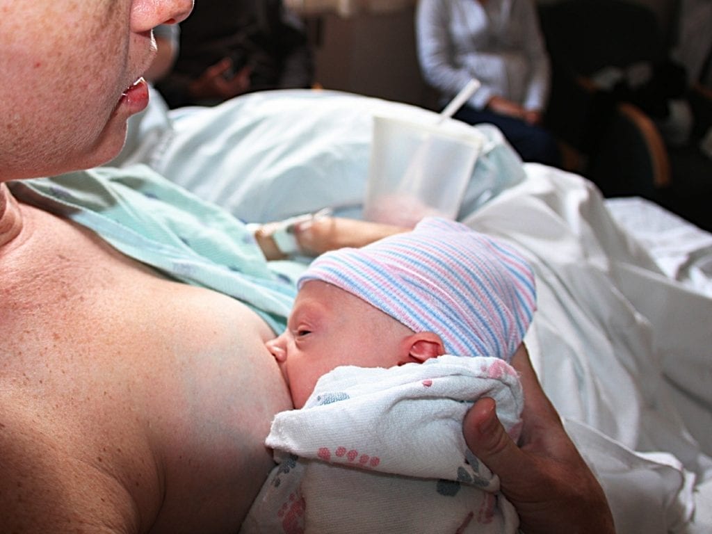 A mother breastfeeding her baby