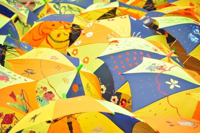 There are many kids' umbrellas with the same colors but different designs. 