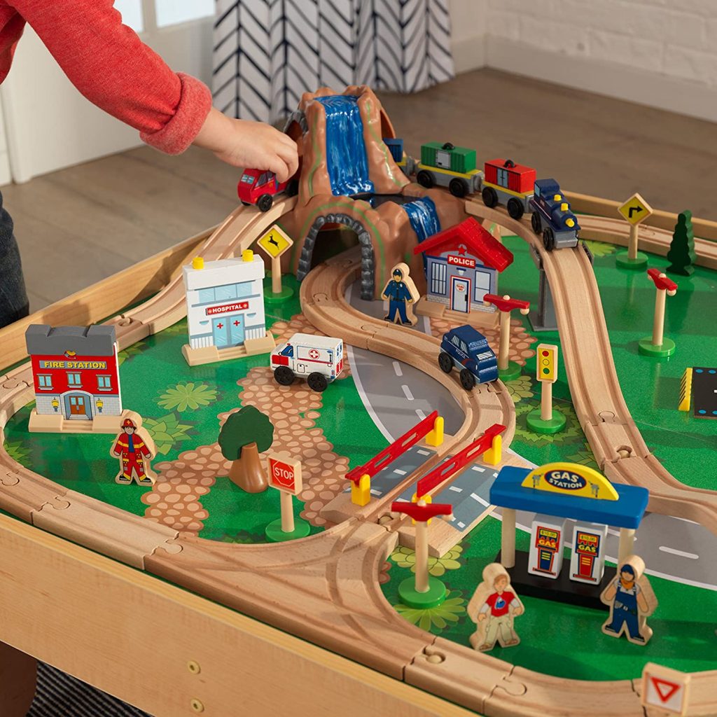 An example of a train toy that’s complex is the imaginarium metro train table set. The idea is that your children are immersive themselves in a world of train tracks where the train is always moving.