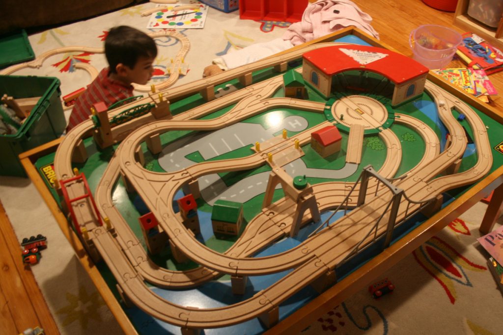 Train Table Imaginariums: The train tables is a specially made table with a track or set on it. 