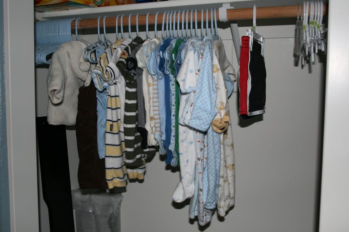 Clothes hanging on baby clothes rods