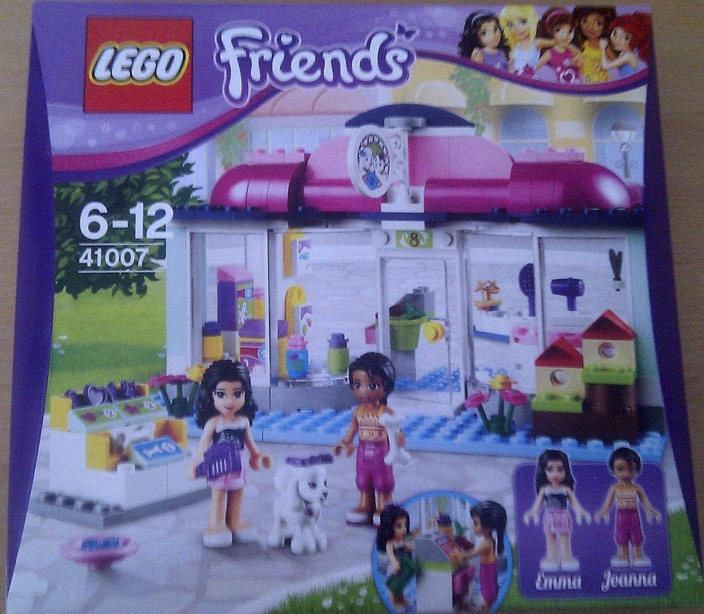A LEGO Friends box, designed ages 6-12, featuring a pet salon, two mini-doll figures, and a dog figure.