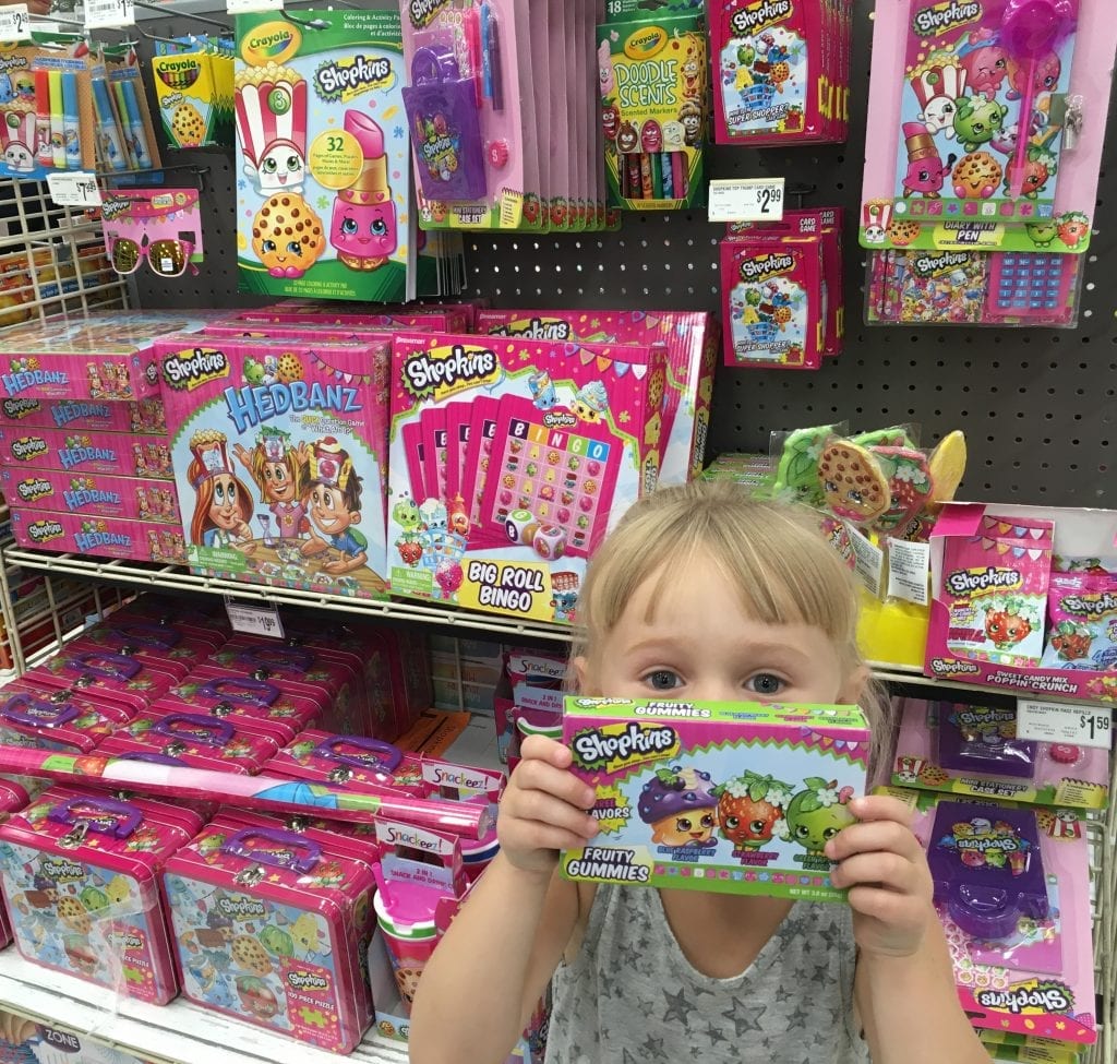 Looking for the best gifts for a 10 year old kid? A picture of a kid holding a small box of toy. We can see as well that they are at the department store. This might be one of the best gifts you can give for your 10 year old girl.