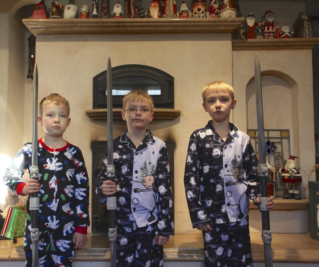 Kids in pajama showing their toys