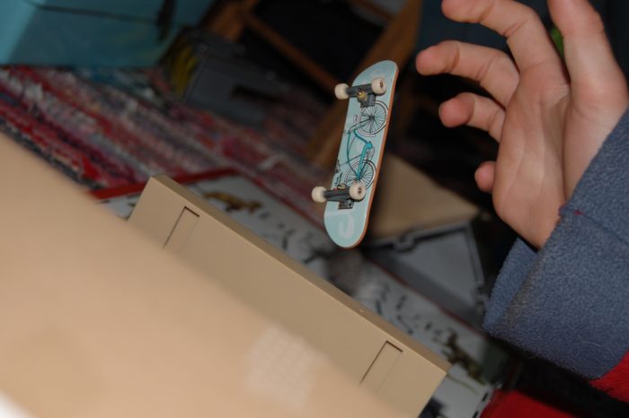 A fingerboard with tech deck skate park made from cardboard