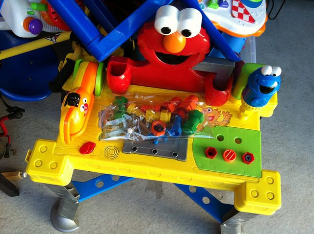 There is a kids tool bench. This bench an Elmo world cartoon design. This play toy has a lot of tools. 