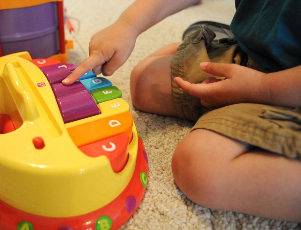 Toddler playing music