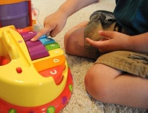 best keyboard: Kids playing music on his best toy.