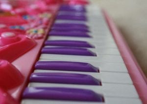 Best toy for kids. Kids piano. Best toy. A best toy piano for kids with white and purple keys.