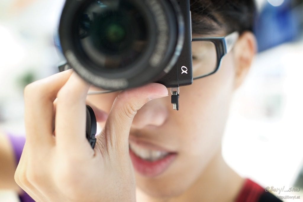 a growing up boy looking through the best camera lens