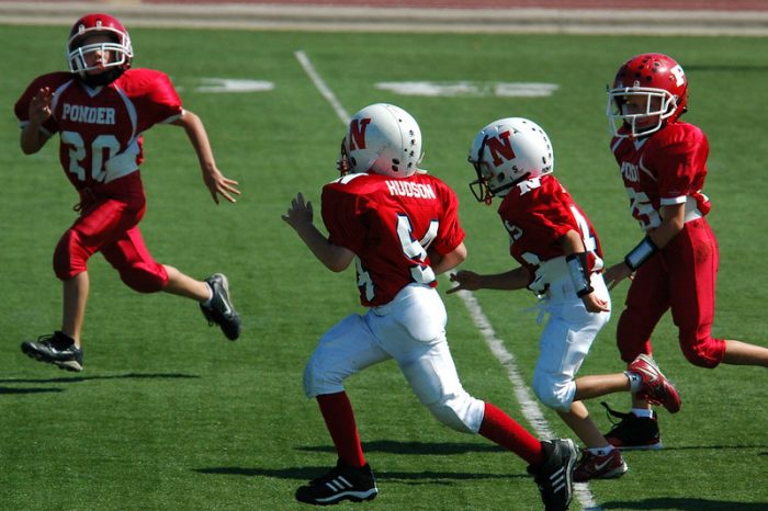 youth with other youth footballing