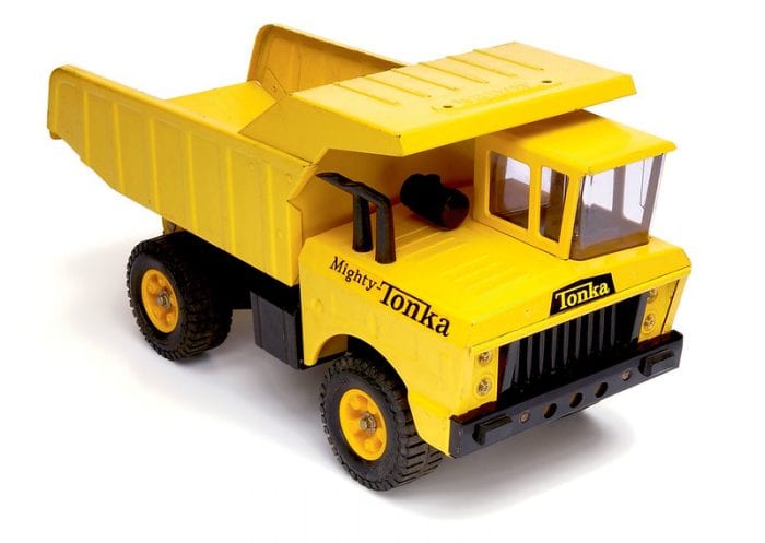 Toy Truck: A yellow Tonka toy tow truck.