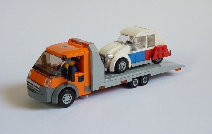 Flatbed tow truck has a movable platform to load and unload car. Compared to max tow truck, the truck has turbo mode.