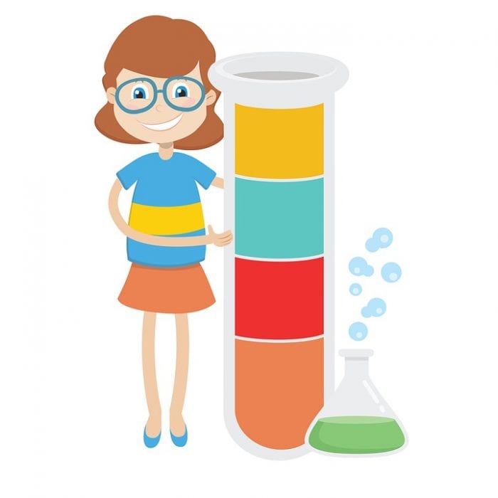 a girl with glasses is smiling while standing beside a colorful glass tube 