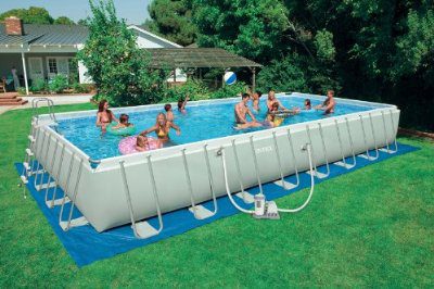 A big inflatable with children happily playing and taking a bath together. The perfect swimming pool but and the whole family.